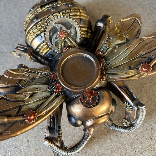 Discover the Steampunk Bee - a whimsical fusion of nature-inspired charm and industrial elegance. Perfect for home or garden decor, this quirky bee sculpture adds a buzz of creativity to any space