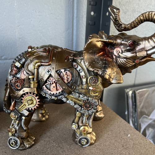 Discover the Steampunk Elephant - a whimsical fusion of nature-inspired charm and industrial elegance. Perfect for home decor, this quirky elephant sculpture adds a touch of safari sophistication to any space